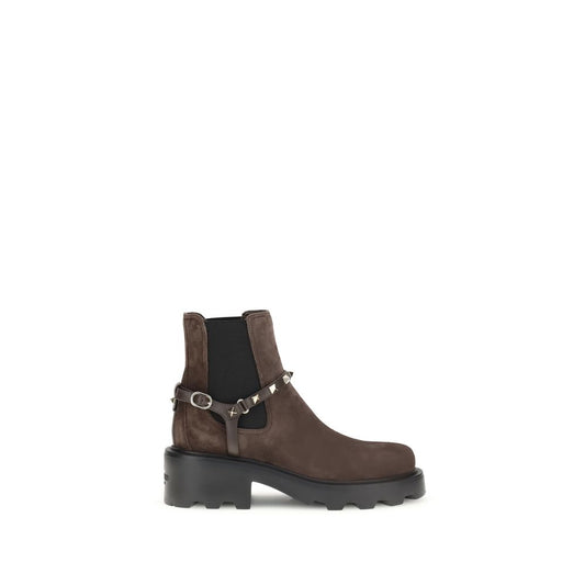 Brown ankle boot with black sole on a white background