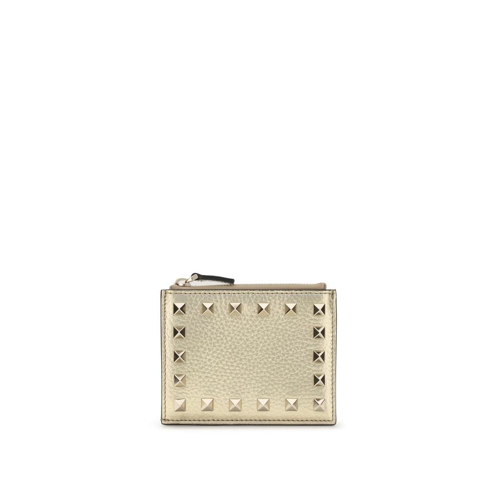 Beige wallet with silver studs on a white background