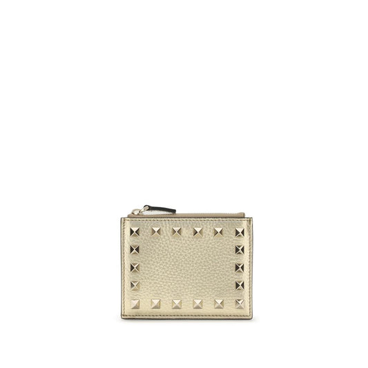 Beige wallet with silver studs on a white background