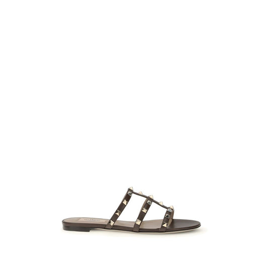 Black sandal with silver straps on a white background